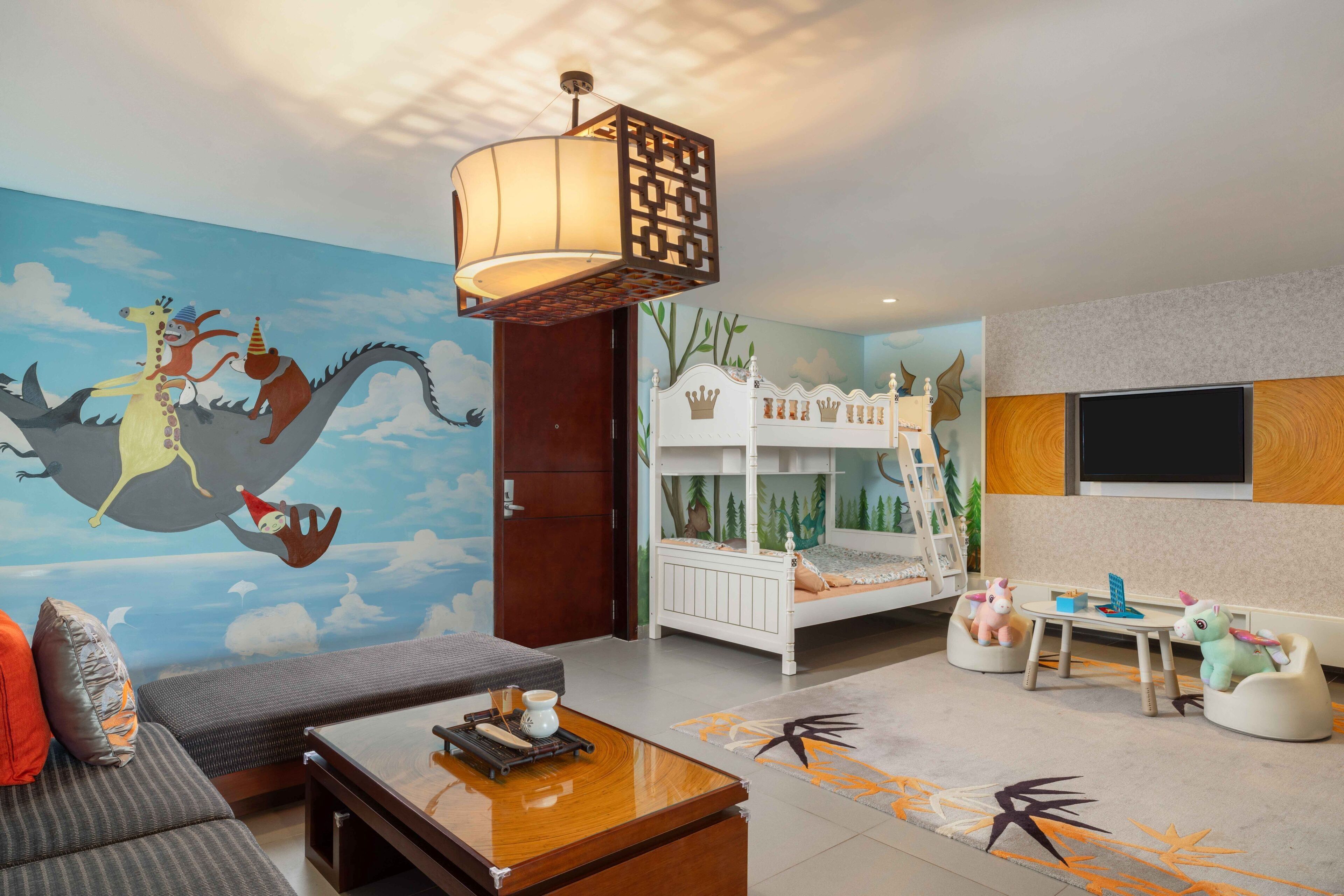 family suite | living area | 42-inch tv with cable channels, fireplace, toys