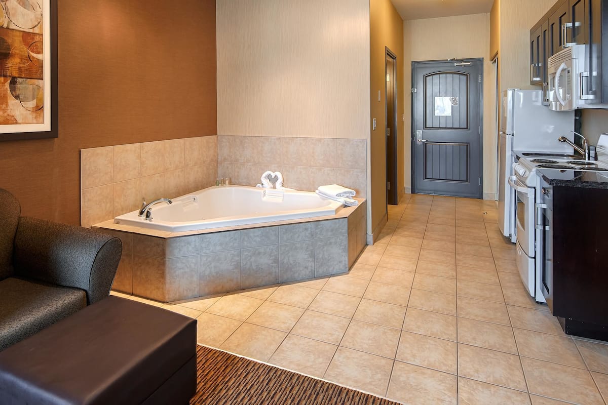 Suite, 1 King Bed, Non Smoking, Jetted Tub | Pillowtop beds, desk, laptop workspace, blackout drapes