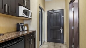 A kitchen with a microwave, coffee maker, and dishwasher. - Best Western Estevan Inn & Suites (Estevan)