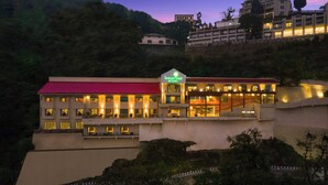 A multi-story building with a red roof and a sign that reads "lemon tree resort." - Lemon Tree Resort, Mussoorie (Dehradun)