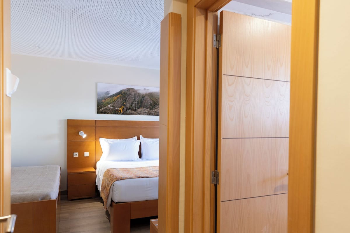 family room | 1 bedroom, in-room safe, desk, blackout curtains