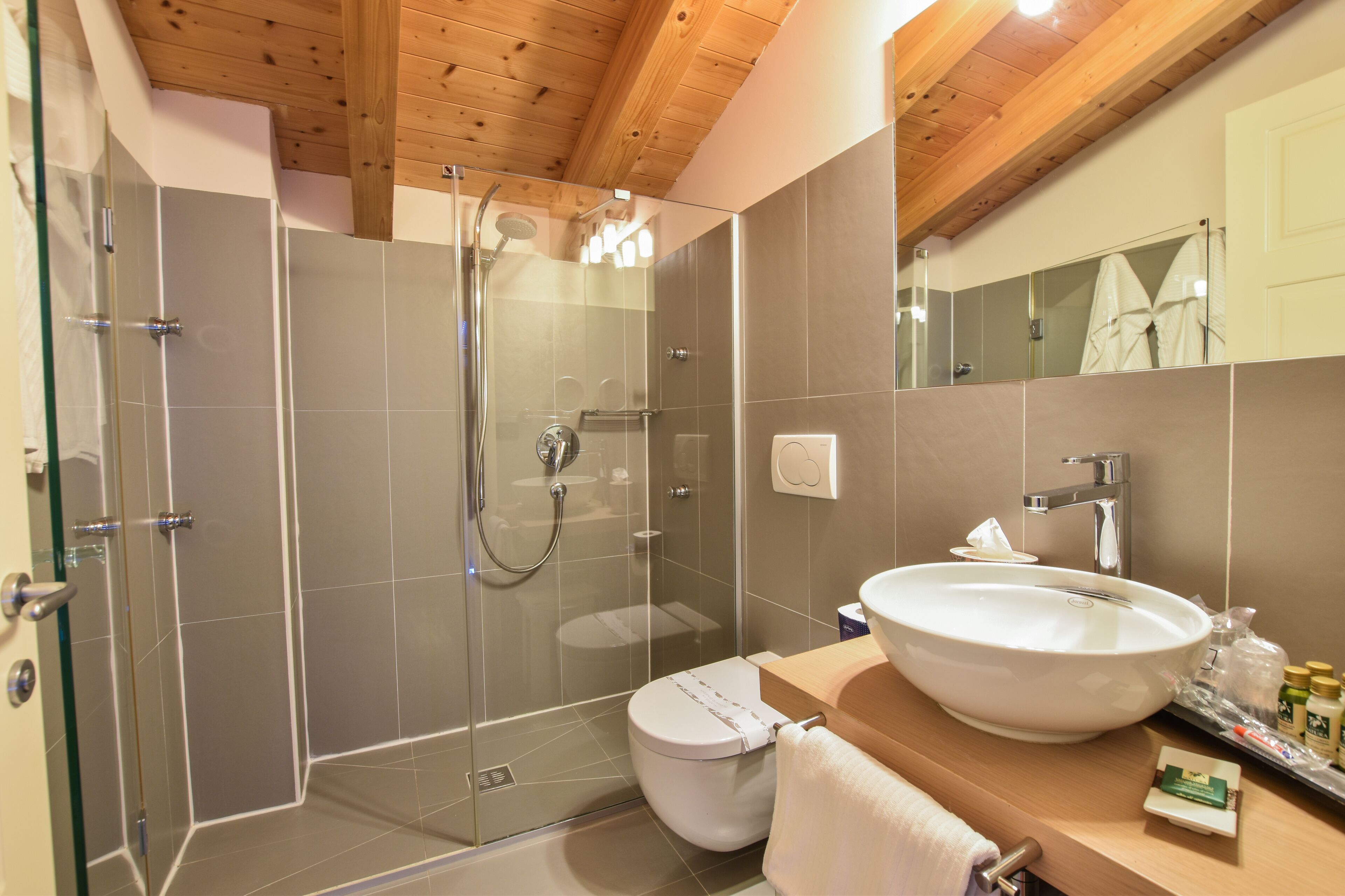 Rainfall showerhead, designer toiletries, hair dryer, bathrobes