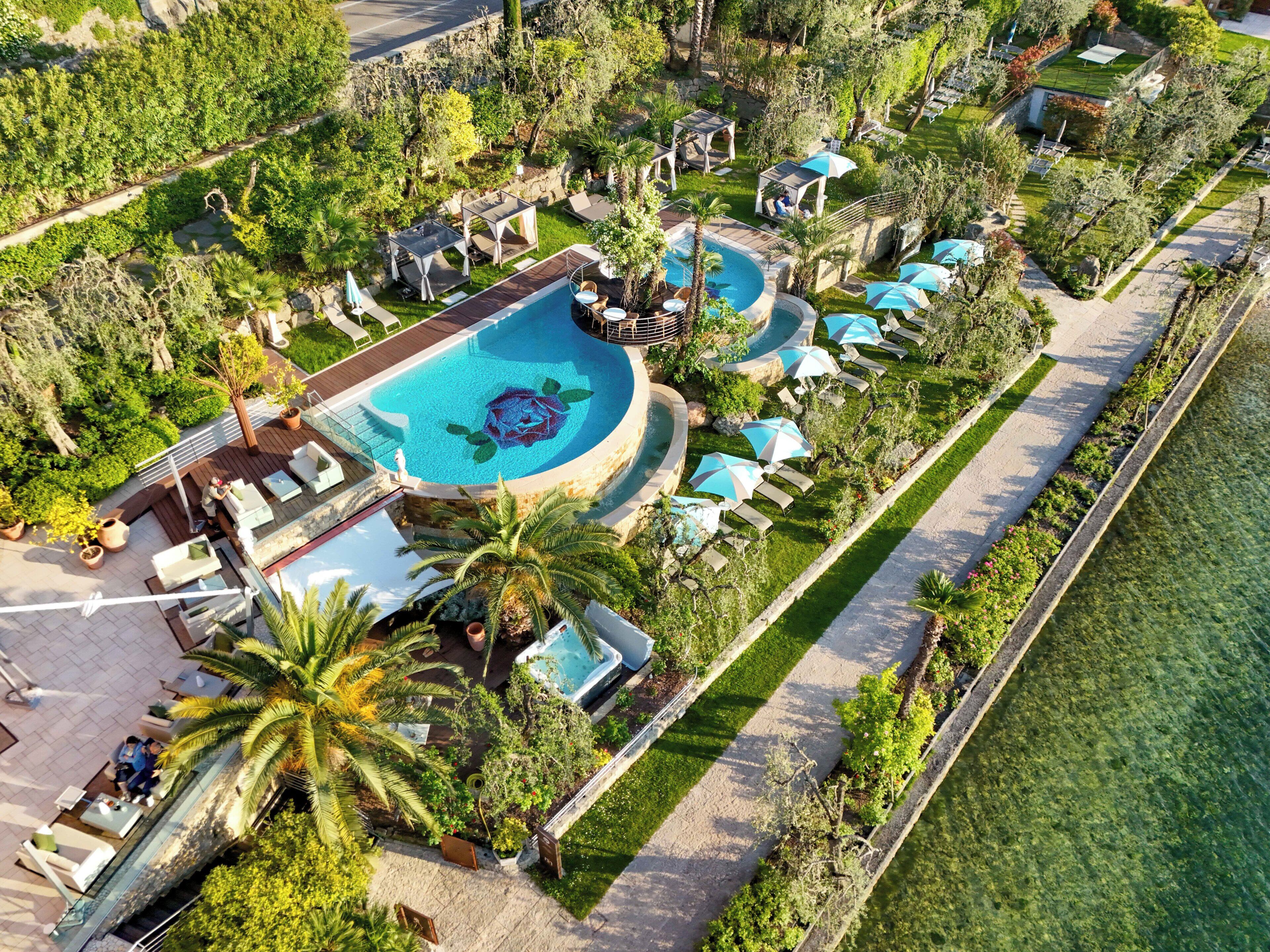 Seasonal outdoor pool, open 7:00 AM to 8:30 PM, pool umbrellas