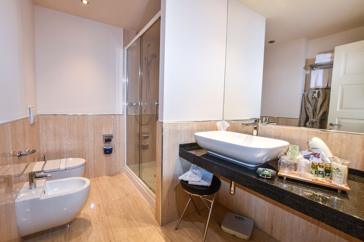 rainfall showerhead, designer toiletries, hair dryer, bathrobes