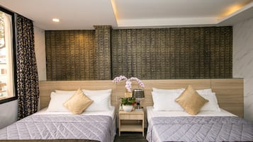 Premium bedding, free minibar items, desk, soundproofing