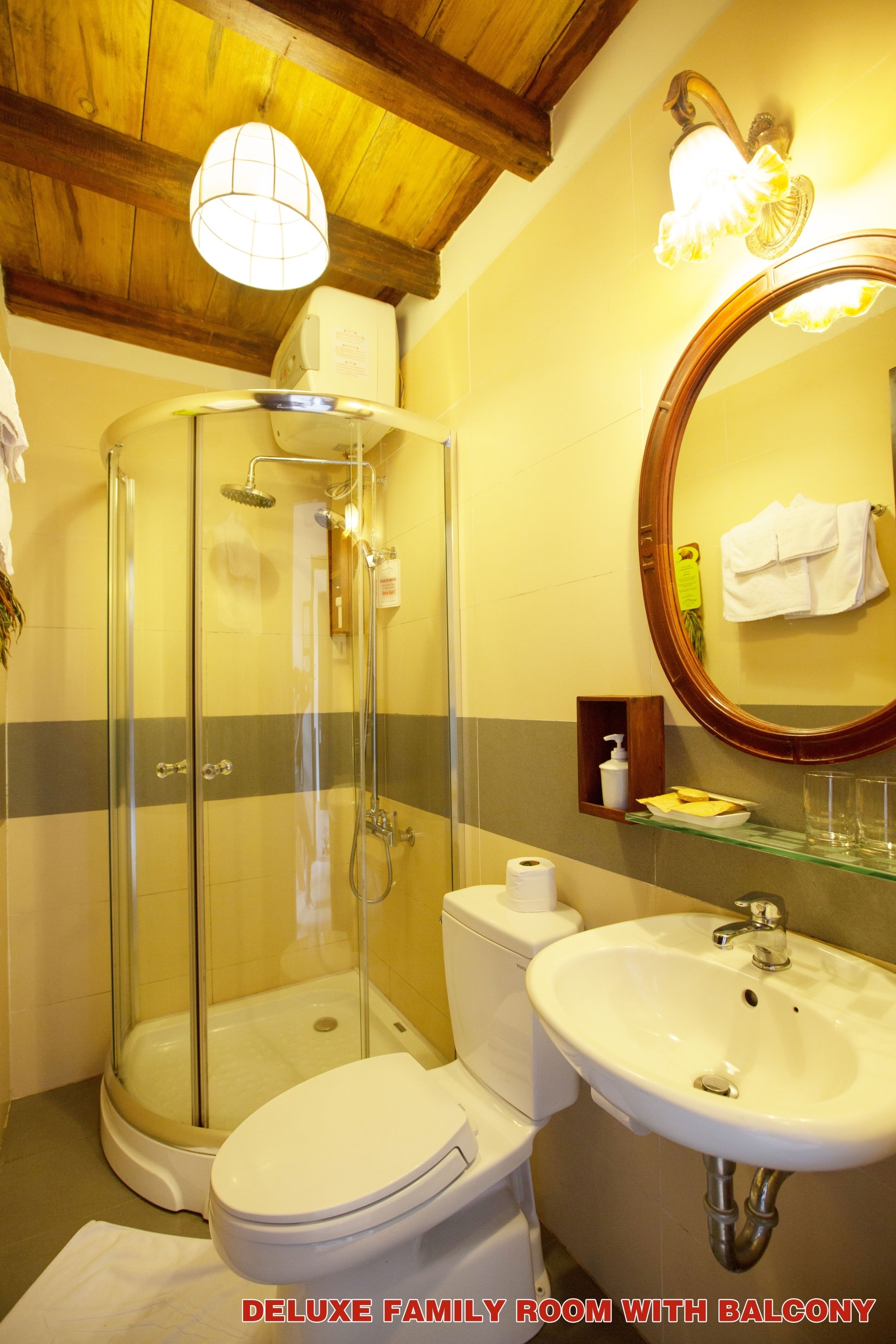 deluxe family room, balcony | bathroom | shower, free toiletries, hair dryer, bathrobes