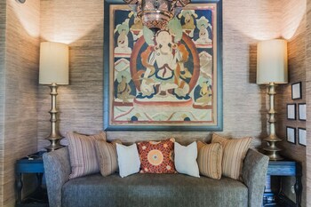 Sitting area in hotel lobby at Lumeria Maui Educational Retreat Center