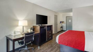 Desk, laptop workspace, blackout drapes, iron/ironing board
