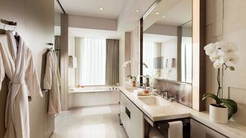 Separate tub and shower, hydromassage showerhead, designer toiletries