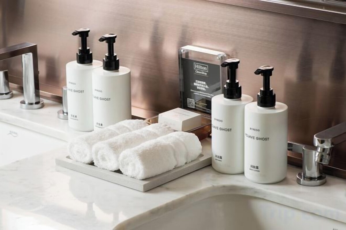 Separate tub and shower, hydromassage showerhead, designer toiletries