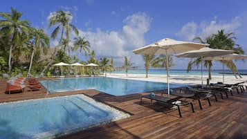 Indoor pool, outdoor pool, pool umbrellas, pool loungers