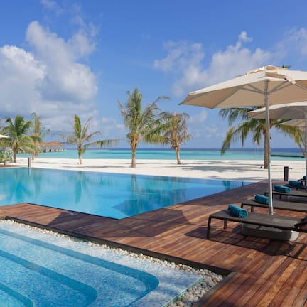 Indoor pool, outdoor pool, pool umbrellas, sun loungers