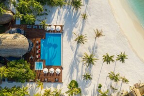 Indoor pool, outdoor pool, pool umbrellas, sun loungers