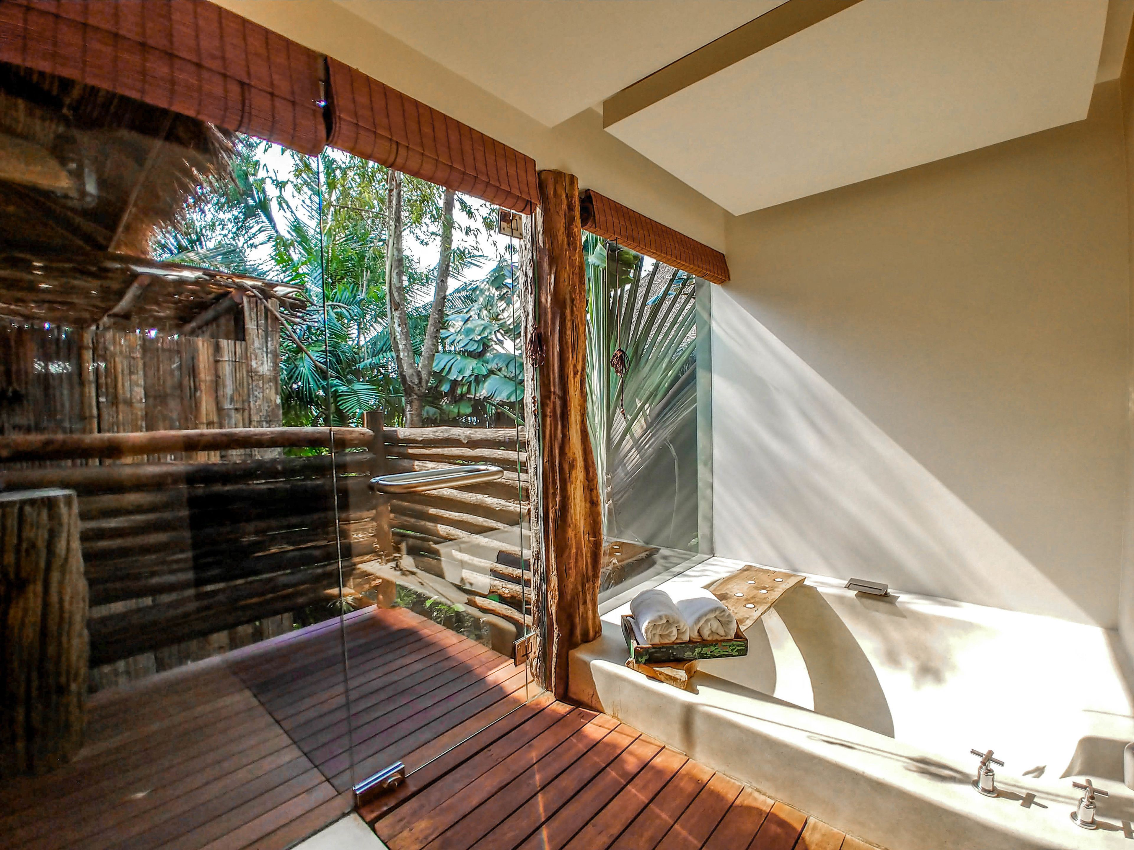 separate bathtub and shower, deep-soaking bathtub, rainfall showerhead