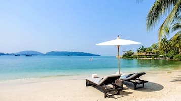 Private beach, white sand, beach towels, beach massages