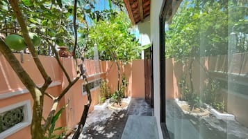 Villa, 1 King Bed, Garden Area | Bathroom | Combined shower/tub, free toiletries, towels