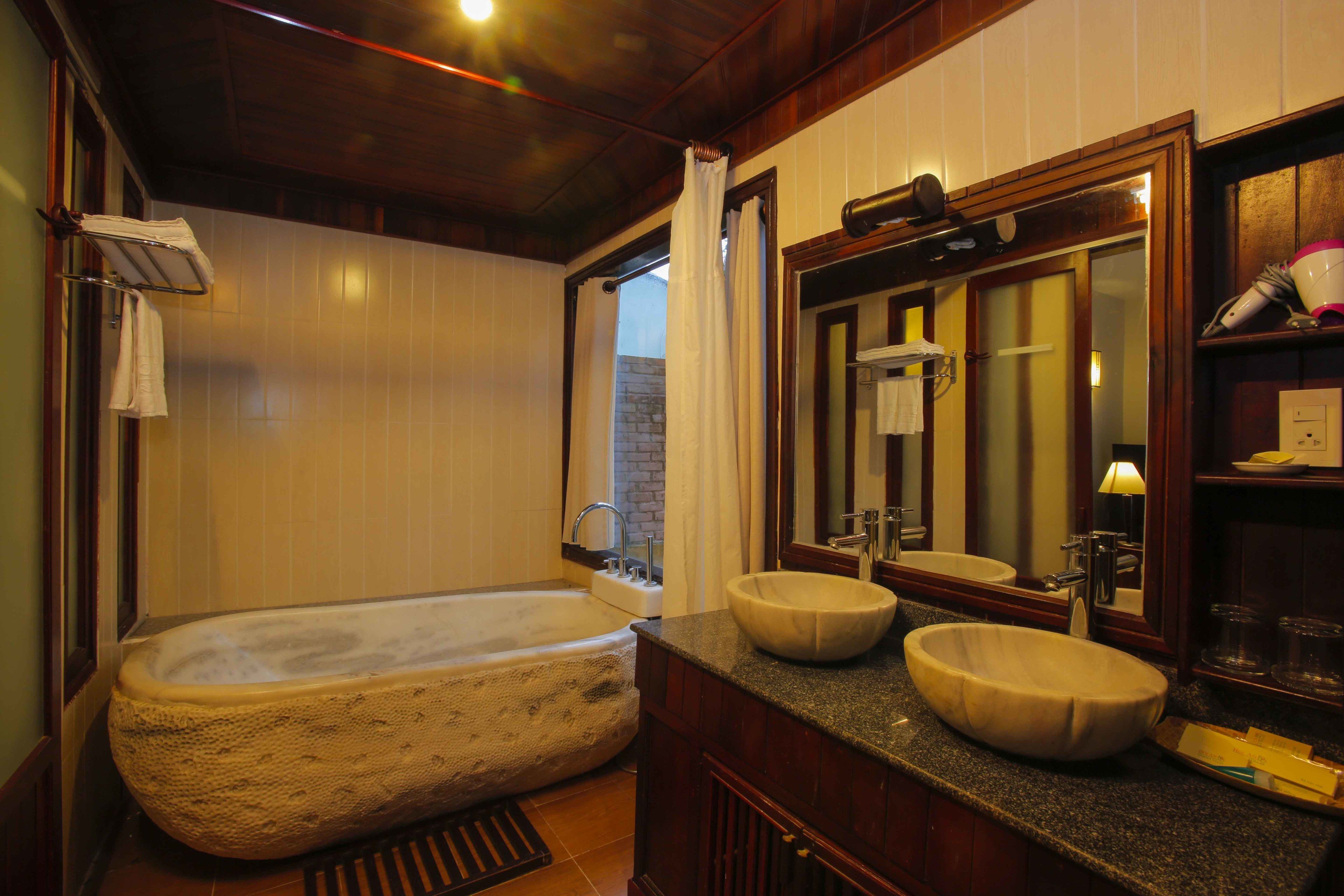 villa, 1 king bed, garden area | bathroom | combined shower/bathtub, free toiletries, towels