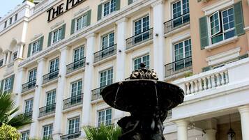Experience the grandeur of The Plaza Hotel's classical facade, featuring a symmetrical design and elegant balconies.