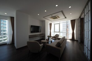 Luxury Suite, City View | Living area | 50-inch LCD TV with satellite channels, TV, Netflix
