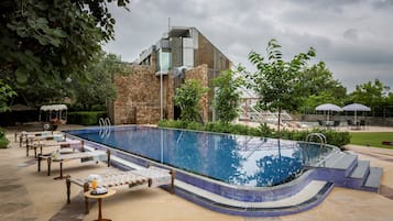Outdoor pool, open 8 AM to 7 PM, pool loungers