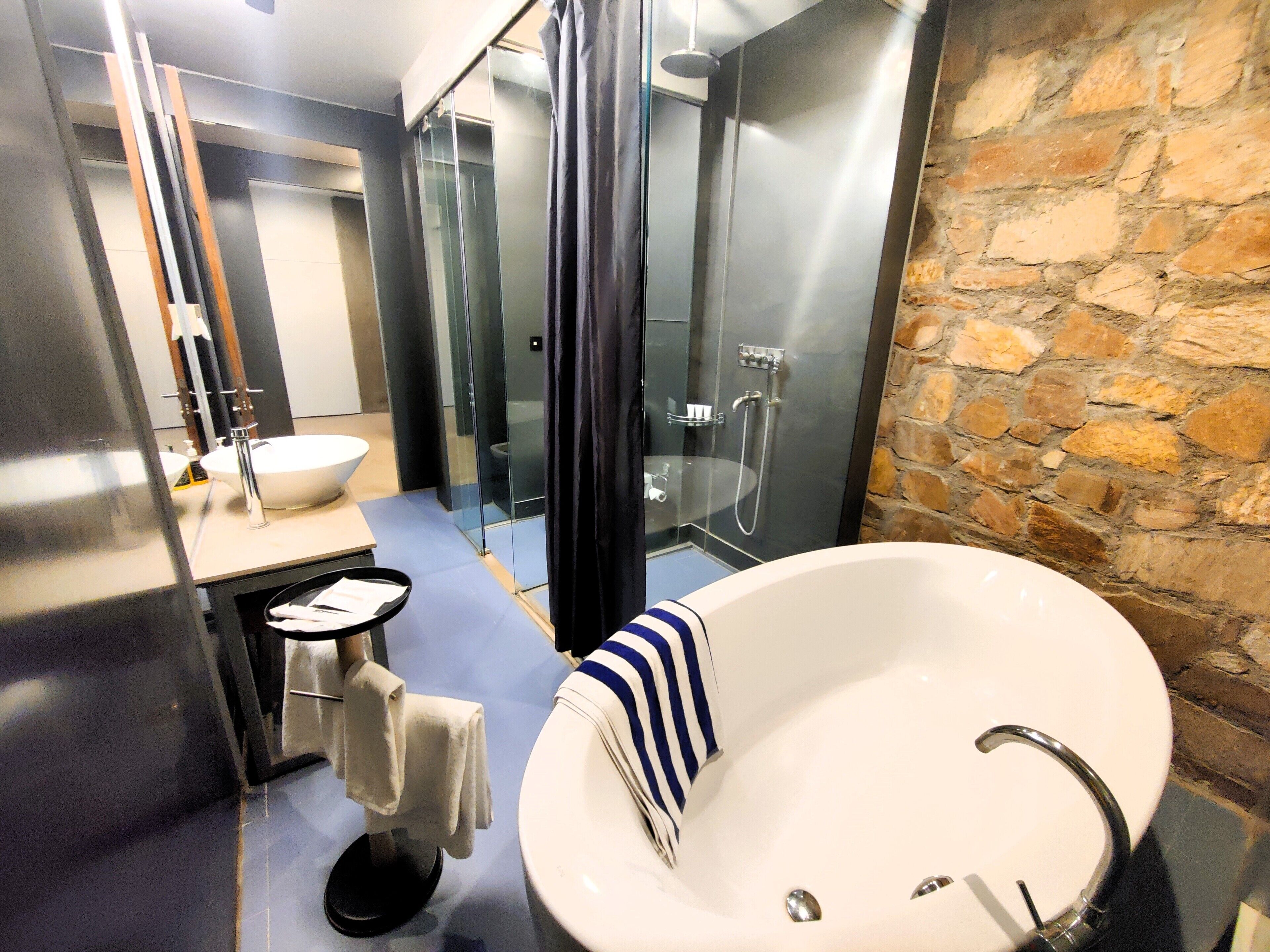 suite, 1 king bed | bathroom | rainfall showerhead, free toiletries, hair dryer, bathrobes