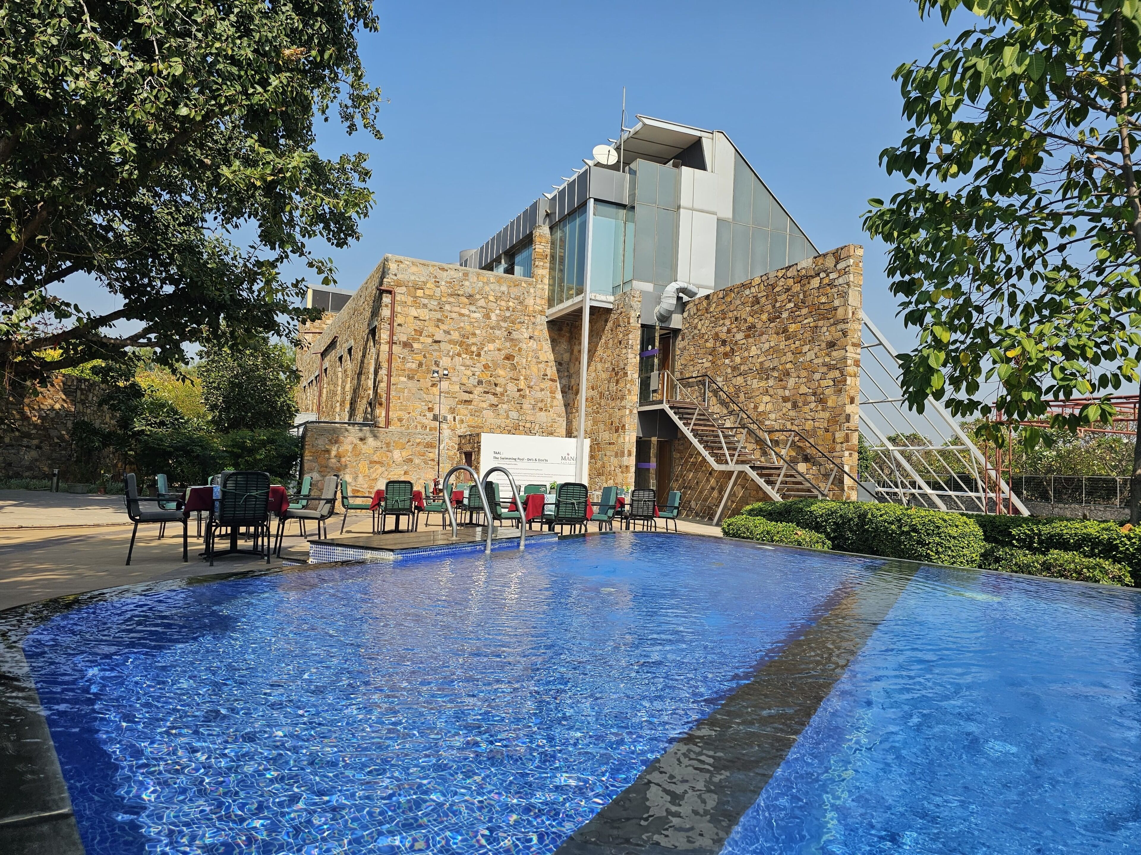Outdoor pool, open 8 AM to 7 PM, pool loungers