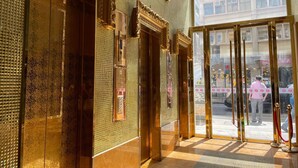 A hotel entrance with ornate golden doors and a clear view of the street outside. - Ramada Hong Kong Harbour View (Hong Kong)