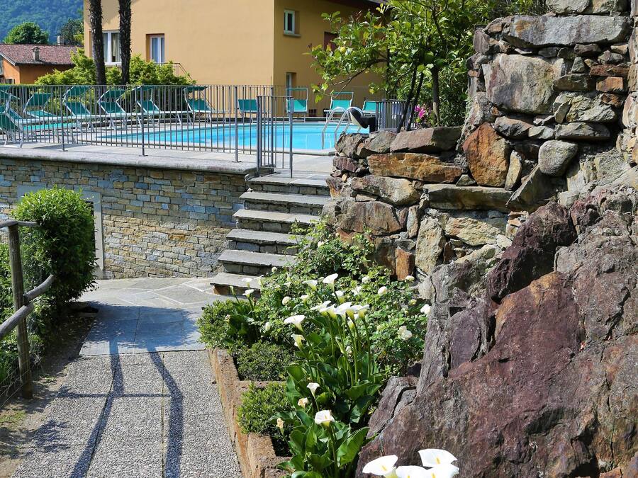 Outdoor pool, open 9:00 AM to 8:00 PM, pool umbrellas, pool loungers