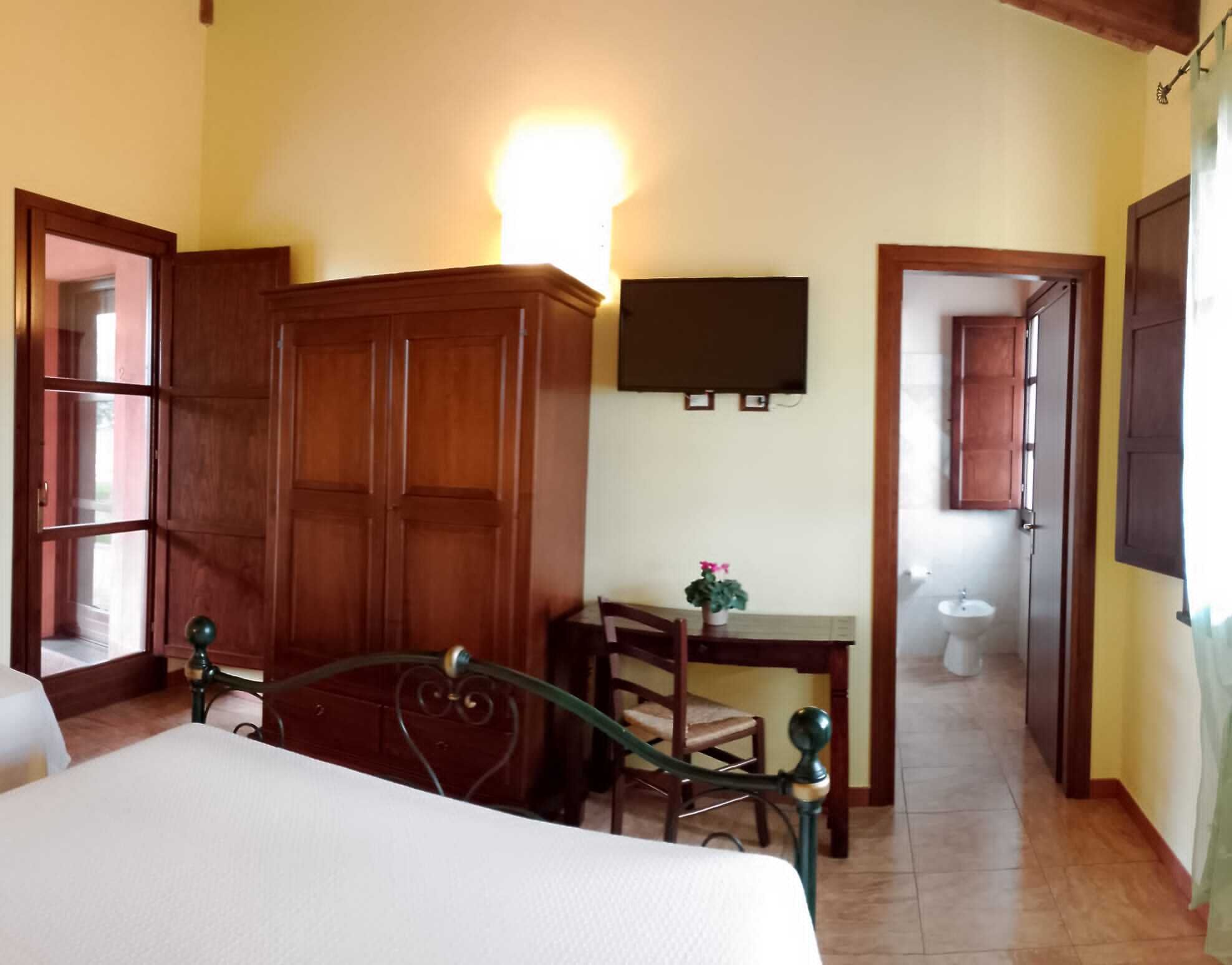 Standard Triple Room, Garden View | Down comforters, desk, blackout drapes, cribs/infant beds