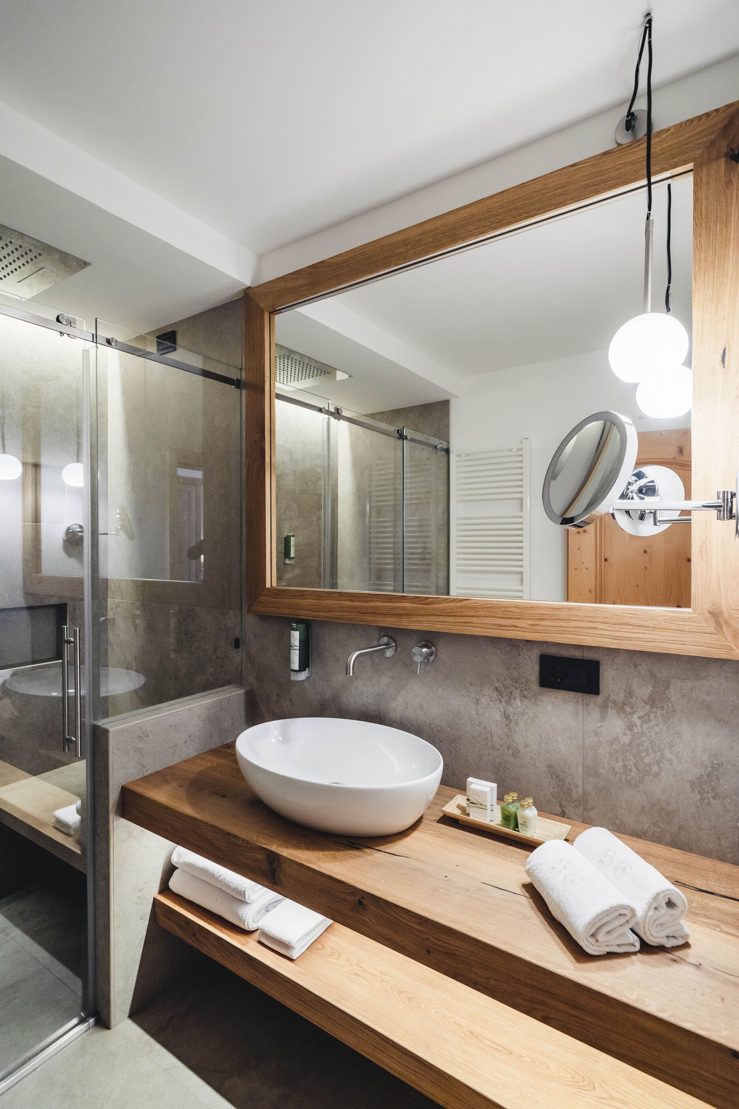 junior suite | bathroom | shower, free toiletries, hair dryer, bathrobes