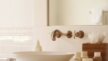 Shower, designer toiletries, hair dryer, bathrobes