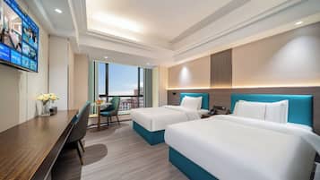 Comfort Twin Room | Premium bedding, laptop workspace, blackout curtains, soundproofing