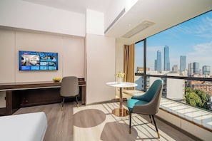 Premium bedding, laptop workspace, blackout curtains, soundproofing