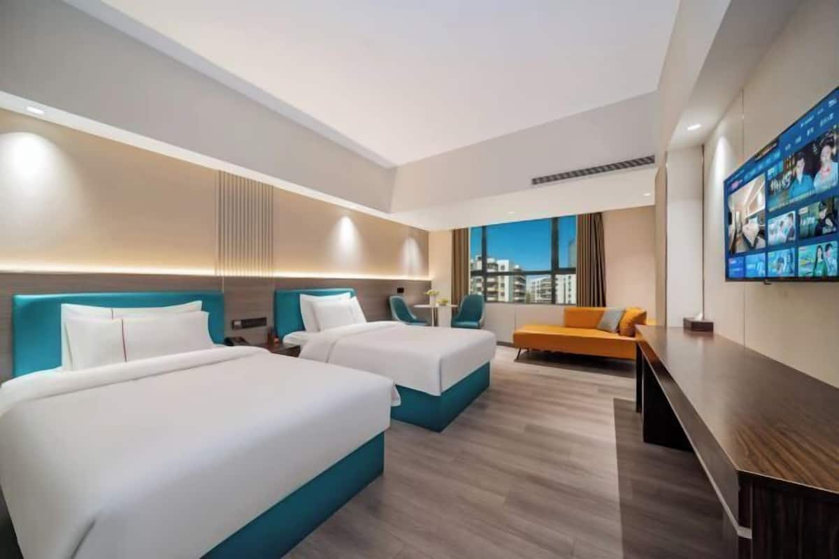Premium bedding, laptop workspace, blackout curtains, soundproofing