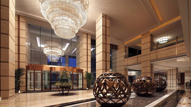 A spacious lobby with a reflective floor, large decorative spheres, and a grand chandelier. - Sheraton Hefei Xinzhan Hotel (Hefei)