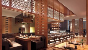 A modern restaurant with a bar area, seating arrangements, and a decorative ceiling. - Sheraton Hefei Xinzhan Hotel (Hefei)
