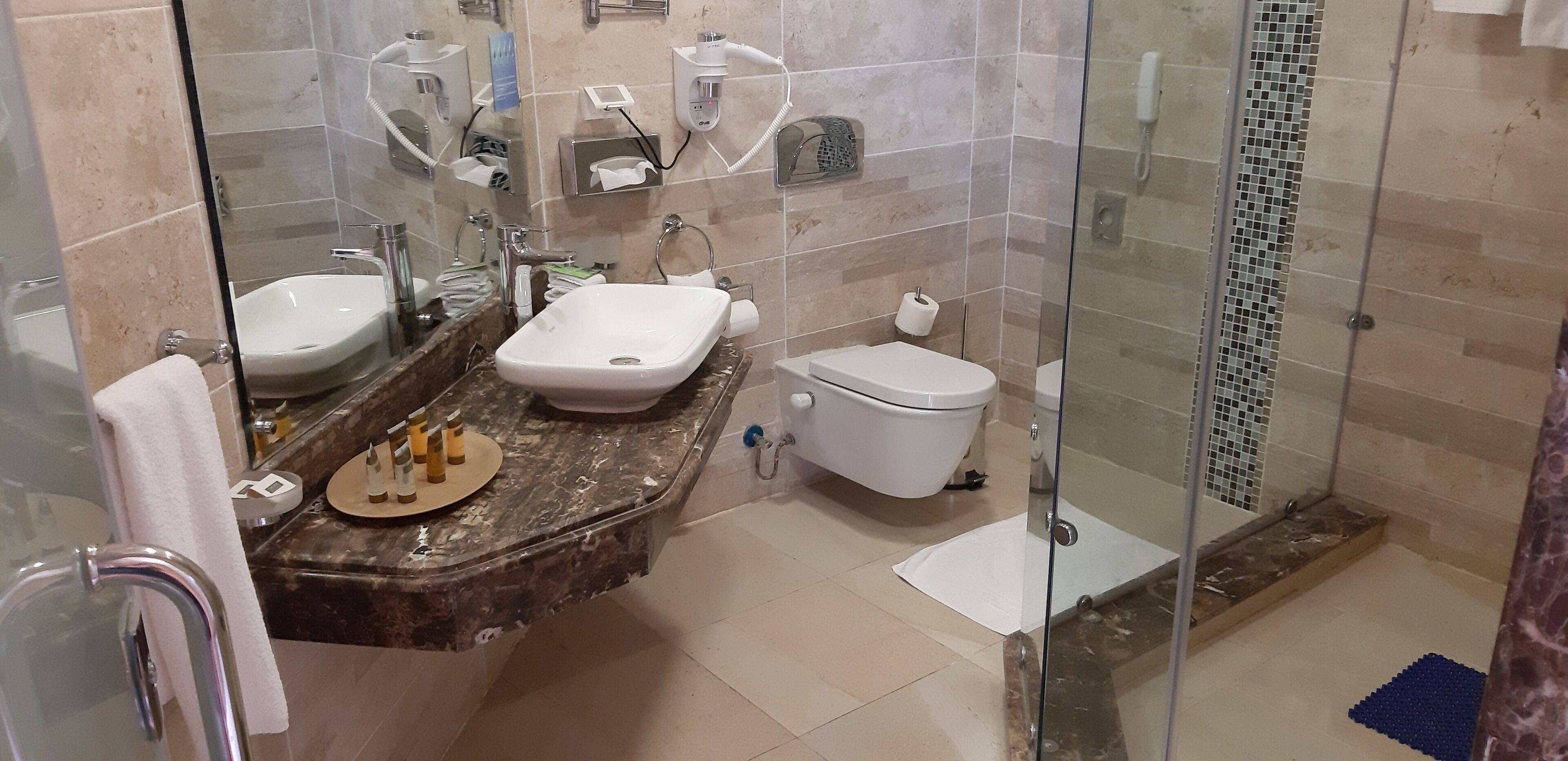 deluxe family beach front view | bathroom | shower, free toiletries, hair dryer, towels