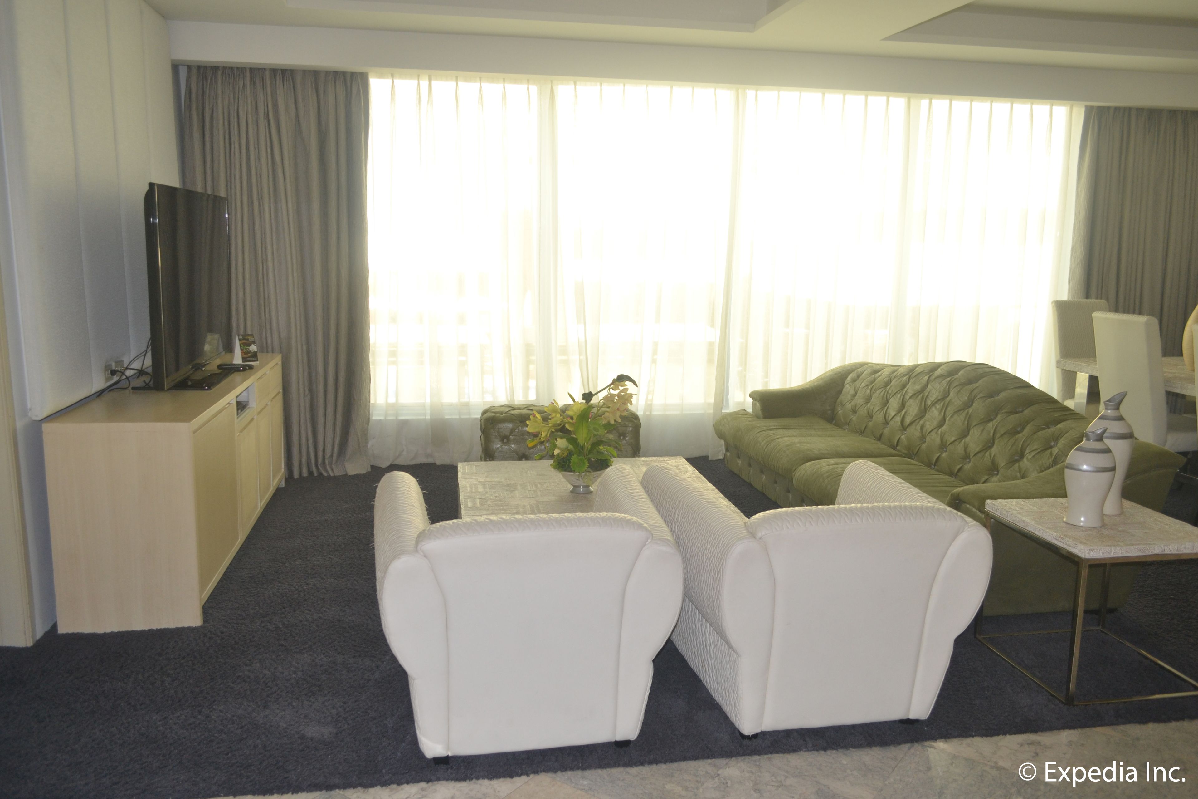 Penthouse, 1 King Bed | Living area | 40-inch LCD TV with cable channels, TV, DVD player