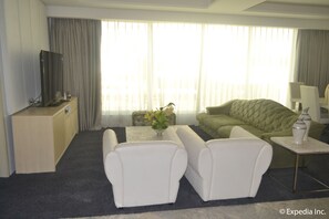 Penthouse, 1 King Bed | Living area | 40-inch LCD TV with cable channels, TV, DVD player