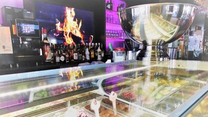 A dessert display with various ice cream flavors in a glass case. - Kunibert der Fiese (Cologne)