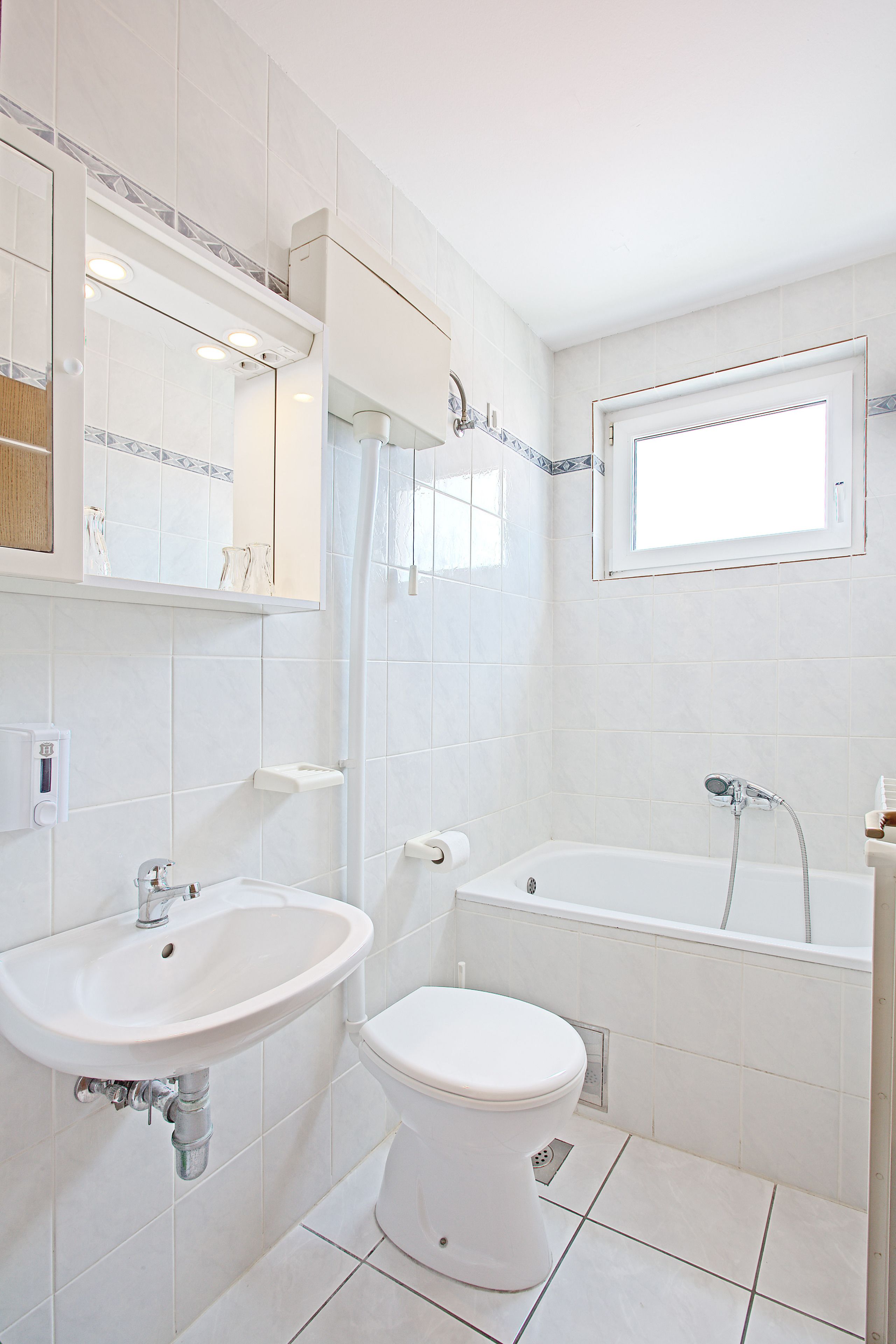 deep-soaking bathtub, hair dryer, towels