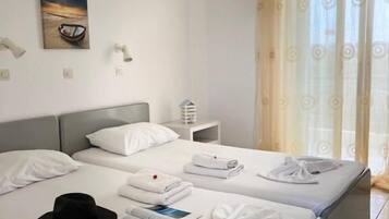 Apartamento família | 1 quarto, lençóis italianos Frette, roupas de cama premium