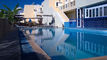 Seasonal outdoor pool, open 8:30 AM to 8:30 PM, pool umbrellas