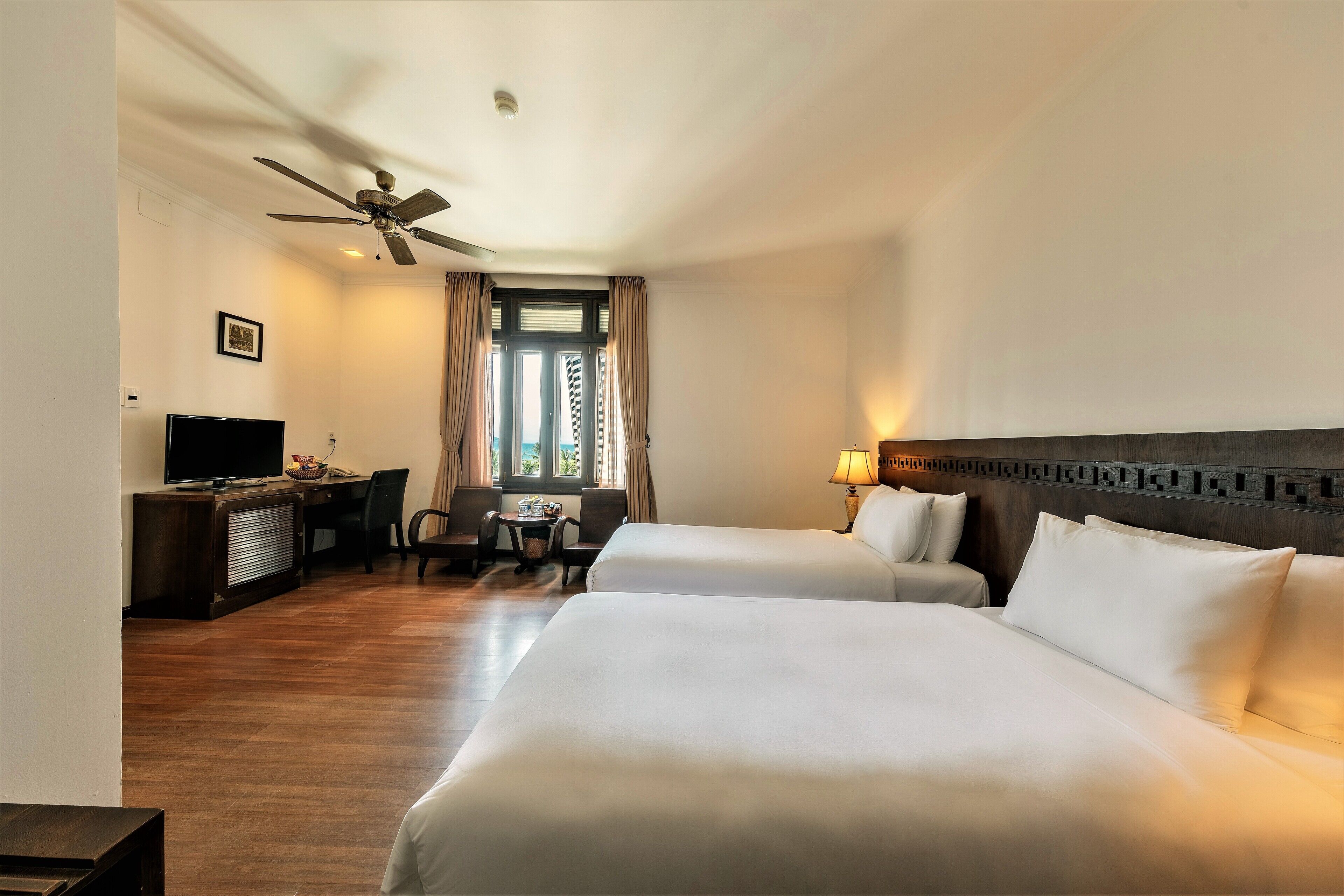 deluxe room partial view | minibar, in-room safe, blackout curtains, soundproofing