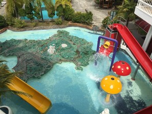 A water park with slides and water features, surrounded by greenery. - Landcons Hotel (Langkawi)