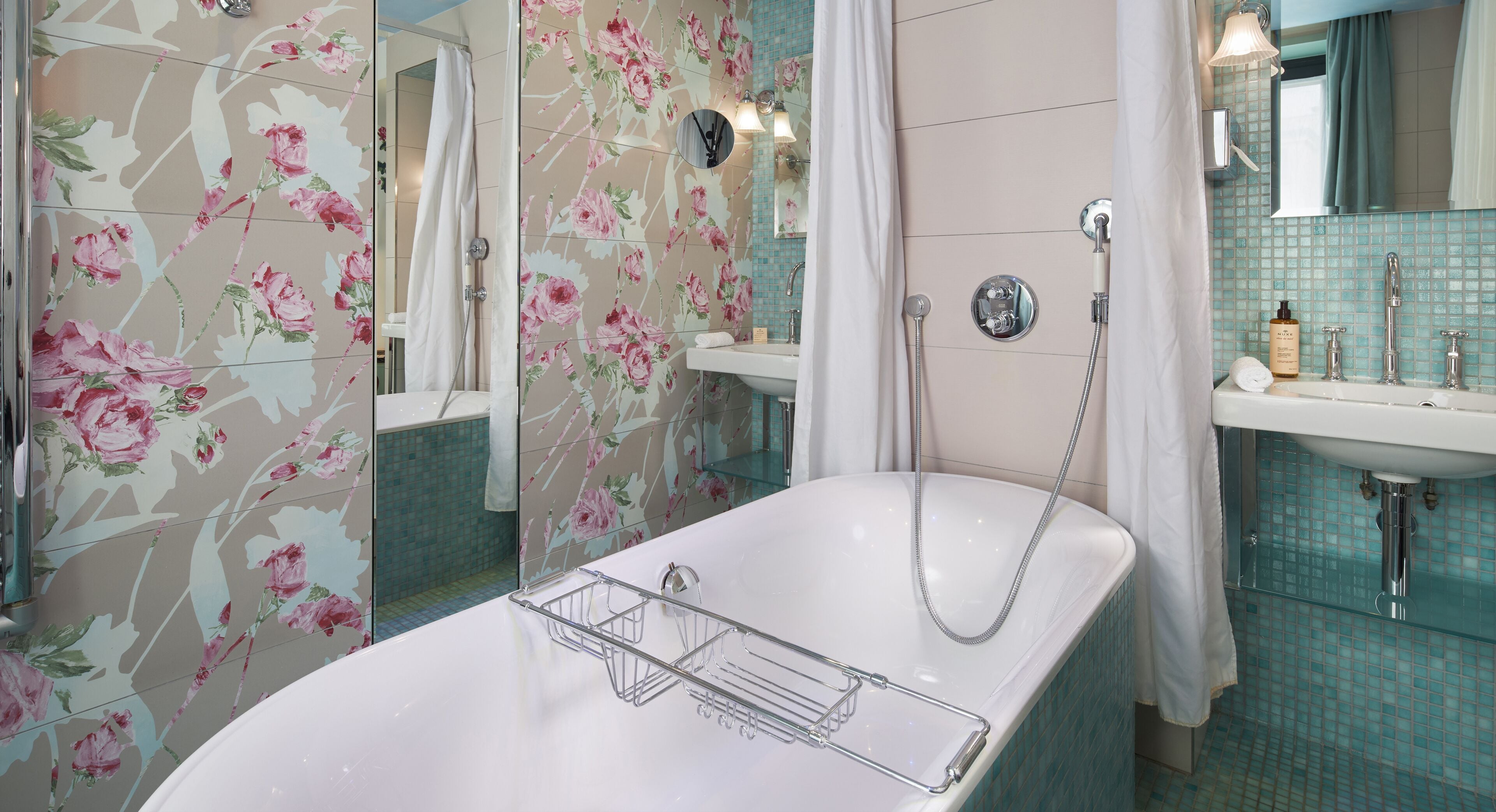 deluxe room | bathroom | rainfall showerhead, free toiletries, hair dryer, slippers