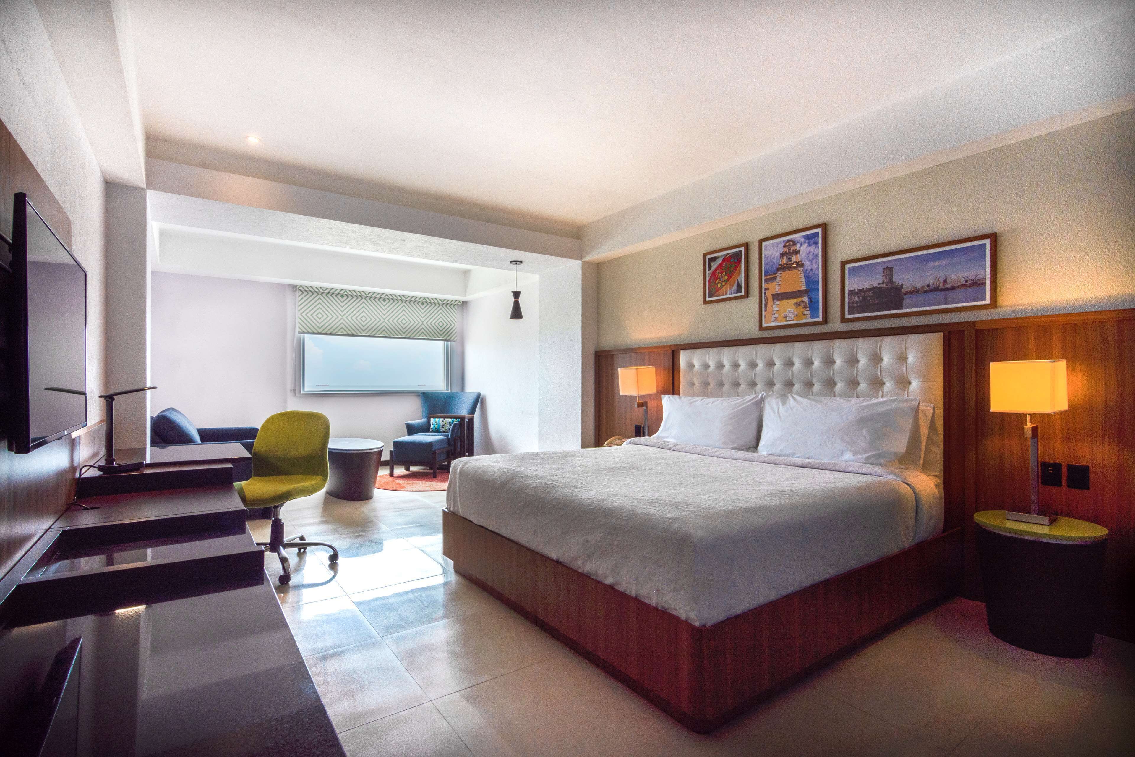 room, 1 king bed with sofa bed, refrigerator | hypo-allergenic bedding, down duvets, in-room safe, desk