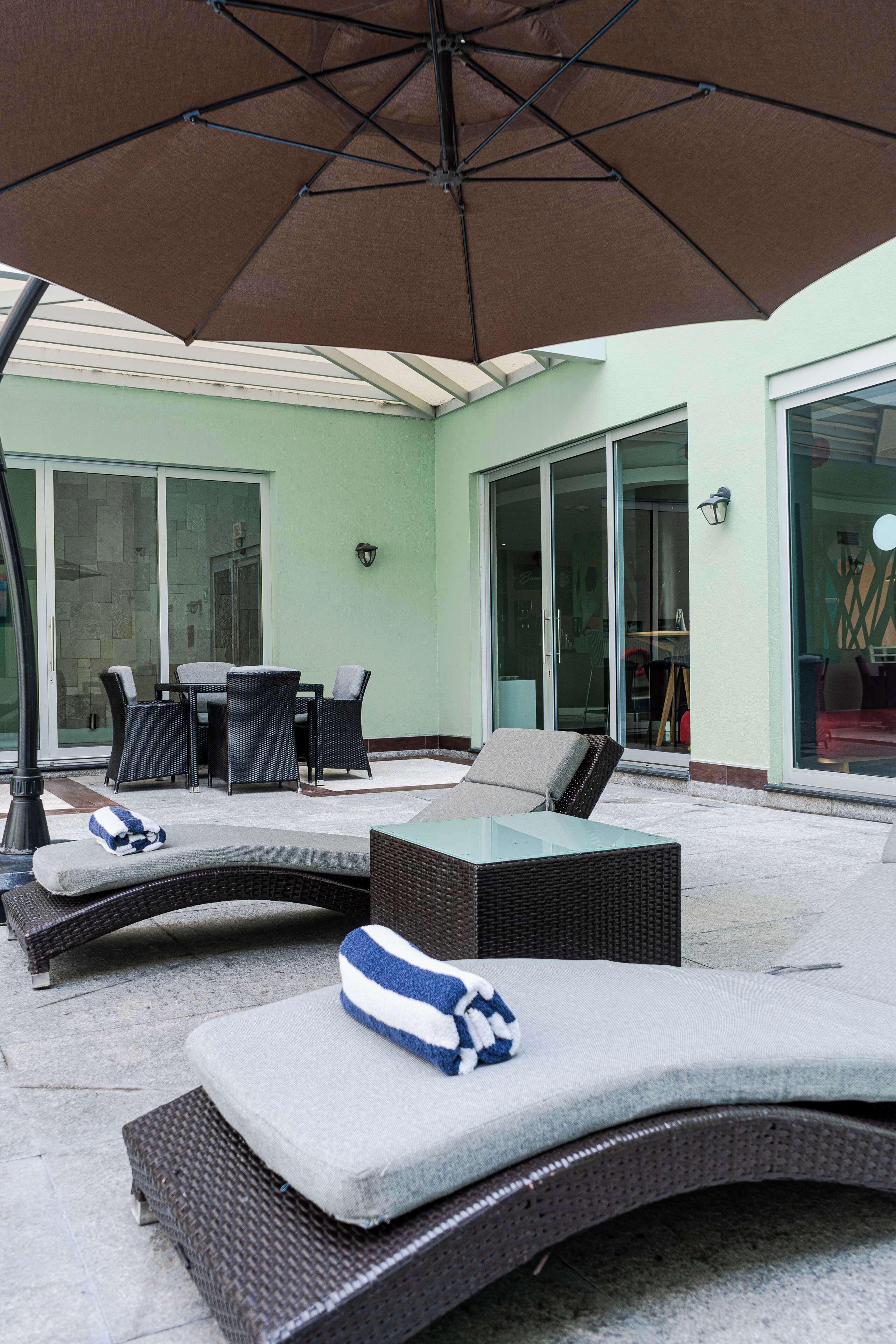 outdoor pool, open 9:00 am to 9:00 pm, pool umbrellas