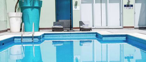 Outdoor pool, open 9:00 AM to 9:00 PM, pool umbrellas