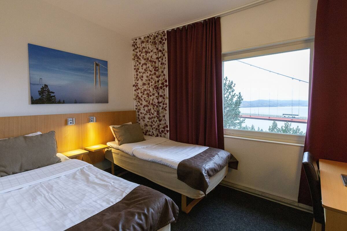 double room, river view | desk, laptop workspace, blackout curtains, iron/ironing board